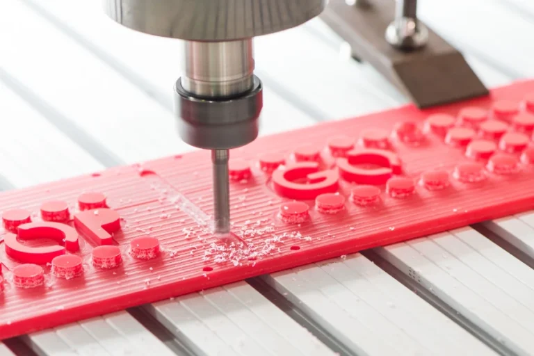 cnc router cutting custom 3d signage from red plastic material