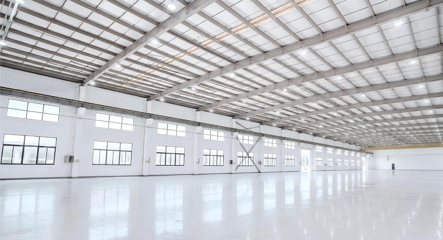 spacious empty modern industrial warehouse with bright lighting